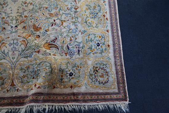 A Persian silk rug, 6ft 8in by 4ft 2in.